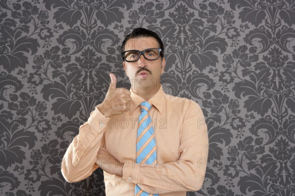 Nerd businessman gesturing ok positive with hand over retro wallpaper