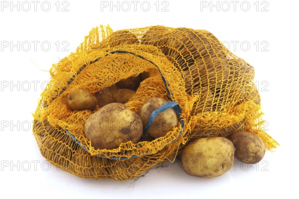 Plastic bag full potatoes isolated over white background