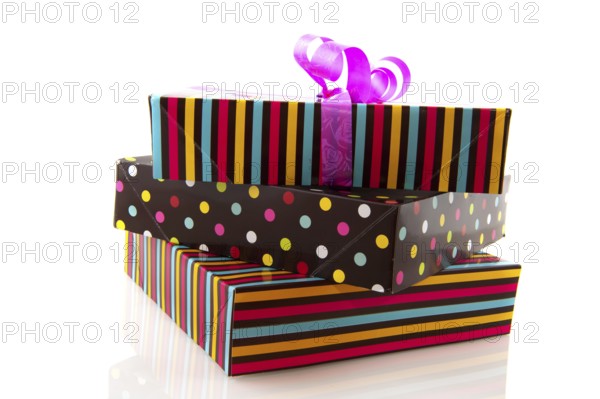 Stacked gifts striped and dotted isolated over white