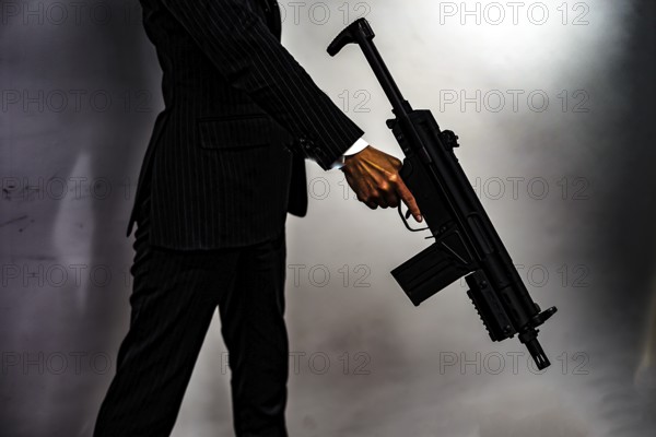 Businessman to fight with a machine gun. Shooting Location: Yokohama-city kanagawa prefecture