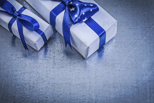 Collection of packed present boxes on metallic background celebrations concept