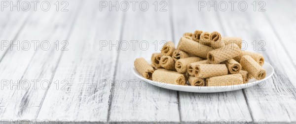 Sweet Wafers as high detailed close-up shot on a vintage wooden table, selective focus