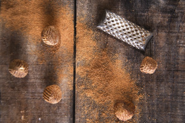 Detail of the grating of nutmeg flavor unique to particular foods and flavors