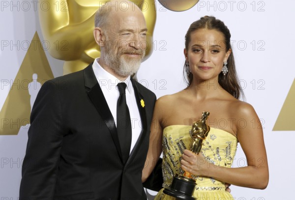 Alicia Vikander and J.K. Simmons at the 88th Annual Academy Awards, Press Room held at the Loews Hollywood Hotel in Hollywood, USA on February 28, 2016., Hollywood, California, USA, North America