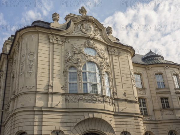 Historic building with baroque façade, elaborate reliefs and sculptures under a slightly cloudy sky, Bratislava, Slovakia, Europe