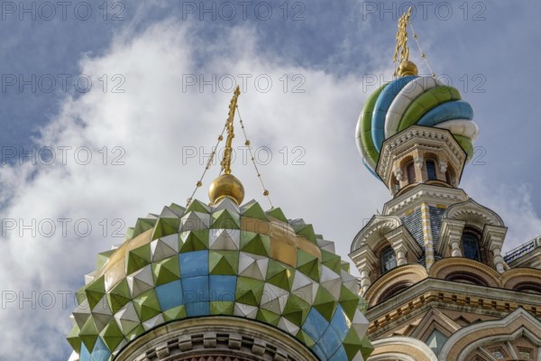 Top view of a church with colourfully decorated domes and golden spires under a cloudy sky, Saint Petersburg, Russia, Europe