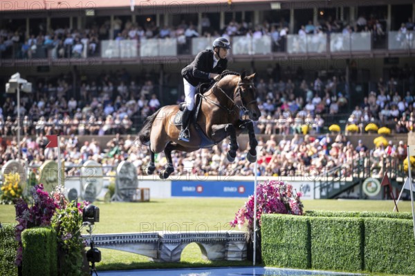 Richard Vogel of Germany and riding United Touch S compete in the first round of the 1.60m CPKC International during the Spruce Meadows Masters, presented by Rolex, in Calgary, Alberta, Canada, North America