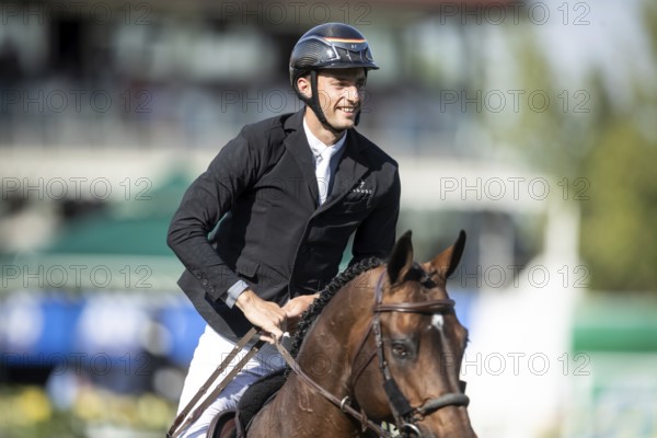 German rider Richard Vogel riding United Touch S competes in the second round and jumpoff of the CPKC International GP at Spruce Meadows Masters, in Calgary, Alberta, Canada, North America