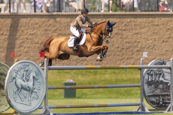 Elena A. Haas, from the United States and riding Claude, compete in the 1.60m Grand Prix during The Continental international competition at Spruce Meadows, in Calgary, Canada, North America