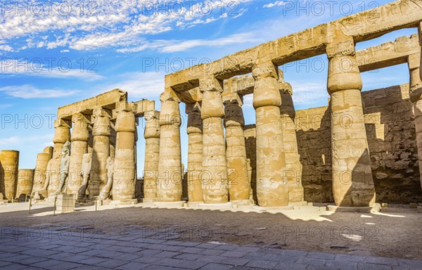 Colonnade in Karnak Temple and blue cloudy sky, Luxor