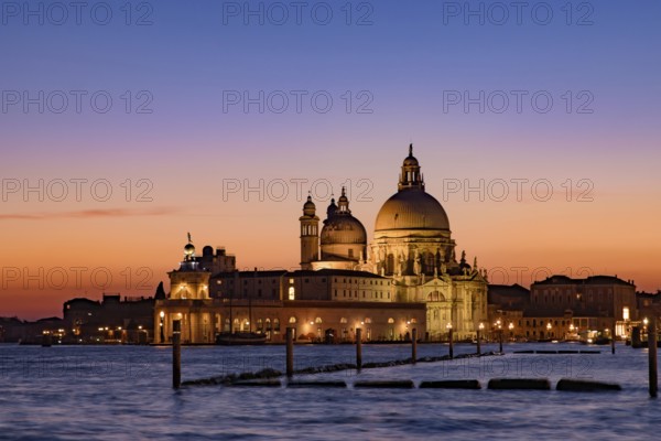Santa Maria della Salute (Saint Mary of Health) at sunset time, a Catholic church in Venice, Italy, Europe