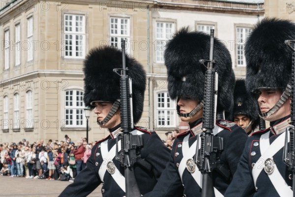 Copenhagen, Denmark, August 12, 2016: Soldiers of the Danish Royal Life Guards for the changing of the guards on the central plaza of Amalienborg palace in Copenhagen. It is the home of the Danish royal family, Europe