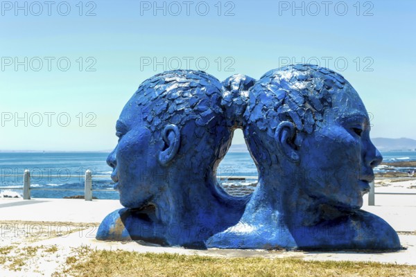 Blue heads statue in Cape Town. Art of south Africa. Sea Point promenade