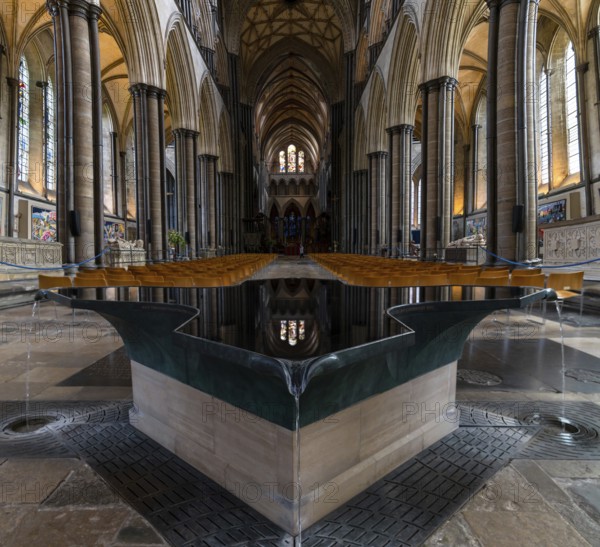 Salisbury, United Kingdom, 8 September, 2022: view of the font by William Pye and the central nave of the historic Salisbury Cathedral, Europe