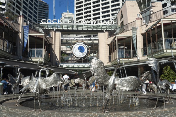 16.09.2018, Sydney, New South Wales, Australia, Cockle Bay Wharf at Darling Harbour with the Dancing Brolga Fountain and the business district in the background, Oceania