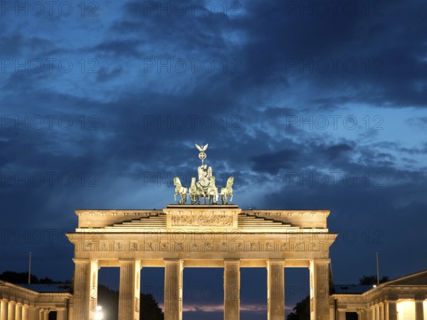 Impressive evening shot of the illuminated Brandenburg Tor against a dark sky, Berlin, Germany, Europe