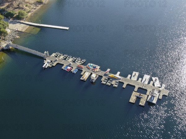 Aerial view of Miramar Lake small pier with pedal boat, small motor boat. Lake with popular activities including boating, fishing, San Diego, California, USA, North America
