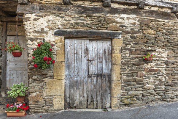 Old wall of a house in the village of Estaing. Aveyron. France