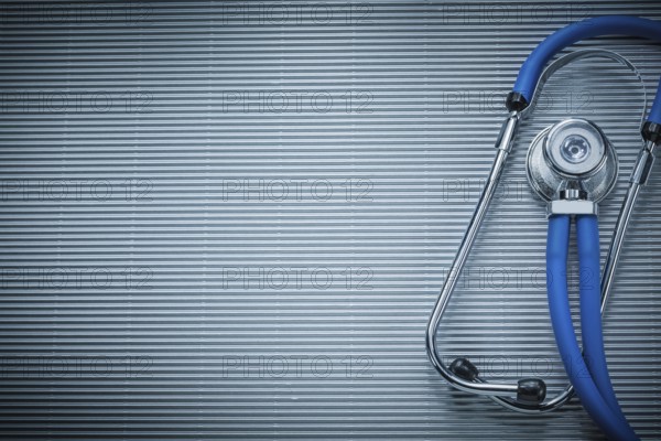 Stethoscope on striped background medicine concept