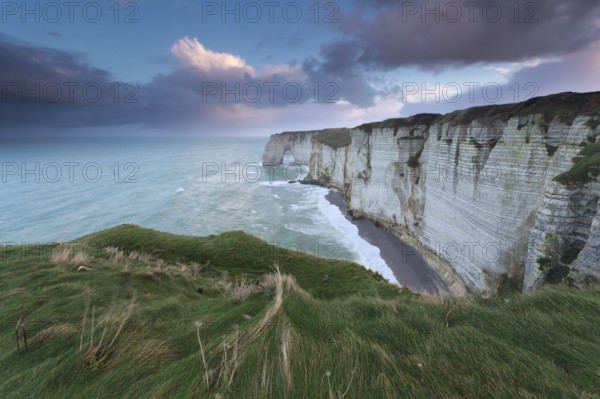 Calm marine sunrise over cliffs in ocean, Normandy, France, Europe