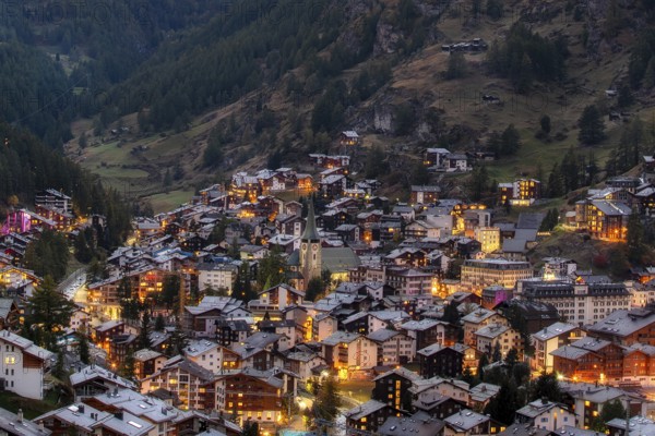 Zermatt, Switzerland aerial town view by night. Swiss Alps
