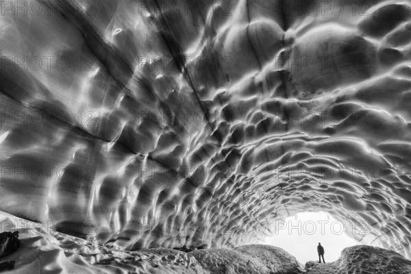 Man in an ice grotto, glacier in the Tarfaladalen valley (Darfalavaggi), Kebnekaisefjaell Norrbotten, Lapland, Sweden, September 2012, Europe