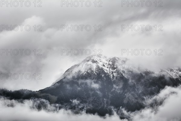 Snowy Peak of Mountain Range in Clouds Obermaiselstein, Germany, Europe