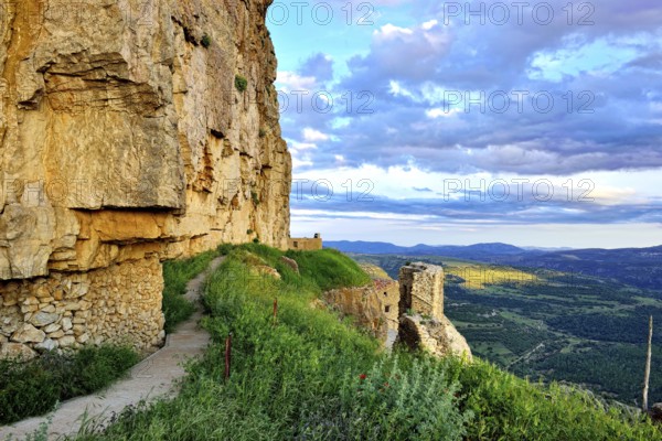 Landscape at sunset with large overhanging rocks and mountain views. Ares in Spain