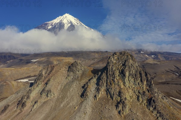 Verblyud (Camel) extrusion rock and the Koryaksky volcano on Kamchatka peninsula, Russia, Europe