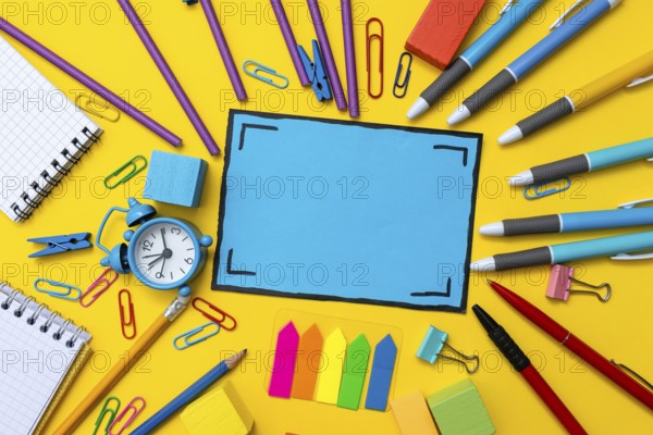 Banner Concept Back To School Alarm Clock Color Chalk Pencil Apple Notebook Stationery on Green Supplies Top View Flat Lay School supplies white background. Back to school concept