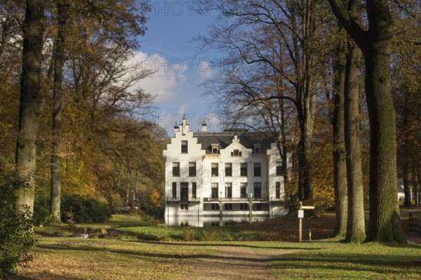 Castle Staverden near Ermelo in the Dutch region Veluwe seen from the surrounding autumn mooded park
