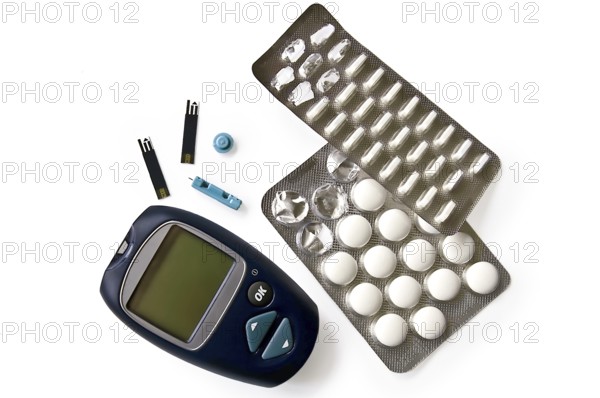 Blue instrument for measuring glucose levels with test strips, needles and pills isolated on white background