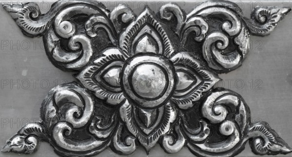 Simple ornament, minted in silver