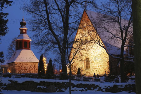 Christmas night scenery in Finland, church in snow, xmas tree