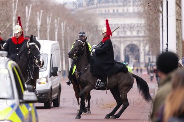 Mounted horse guards in ceremonial uniforms on a street in the City of Westminster, Greater London, United Kingdom, Europe