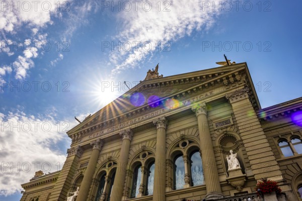 Beautiful Bundeshaus Parliament Building or Federal Palace in a Sunny Day with Sunbeam and Lens Flare in City of Bern, Canton Bern, Switzerland, Europe