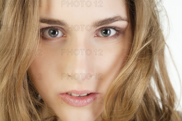Close-up portrait of pretty young woman with long blond hair, Belgium, Europe