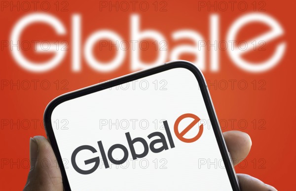Global E logo is displayed on smartphone. Global E Online Ltd is an Israeli software publisher that facilitates cross border ecommerce for businesses