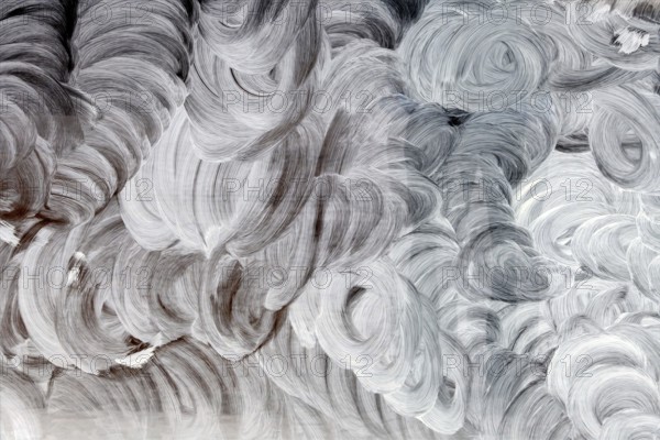 Glass smeared with white paint, symbol for background, texture, chaos Austria