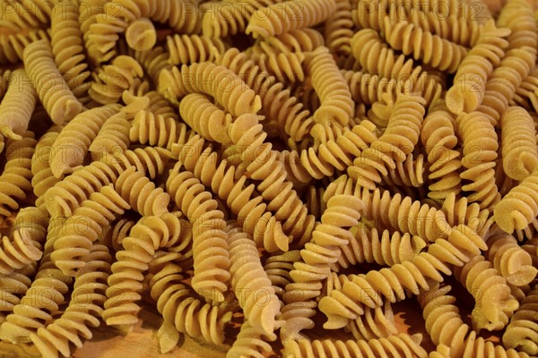 A close up of some raw fusilli