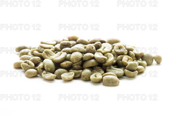 Green coffee beans heap isolated on white