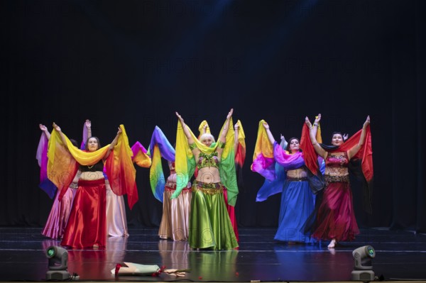 July 01, 2023. Belarus.the city of Gomel. An oriental dance ensemble. A group of women of different ages are dancing an Arabic belly dance