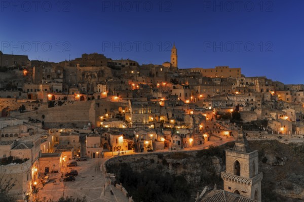 Matera, Italy, 26 November, 2023: view of the old town of Matera after sunset with the lights coming on, Europe