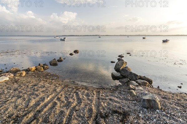 Natural boat ramp on a beach at the Baltic sea in peaceful morning light