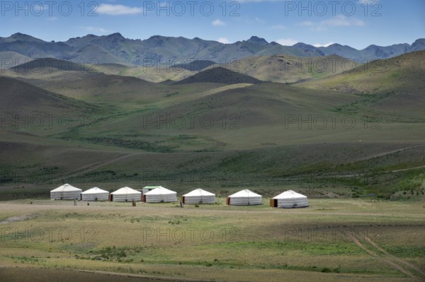 Traditional yurts between montains at sunset, Mongolia, Asia