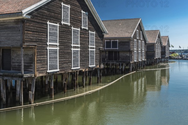 Hudiksvall, Halsingland, Gavleborg County -Sweden, 08 01 2019 Reflecting fishing warehouses in the city center