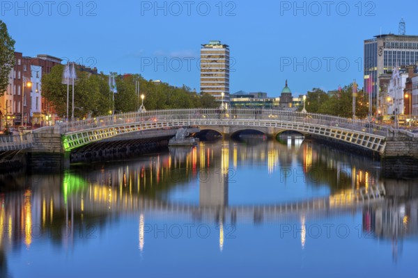 The River Liffey and the famous Ha'penny Bridge in Dublin, Ireland, at dusk, Europe