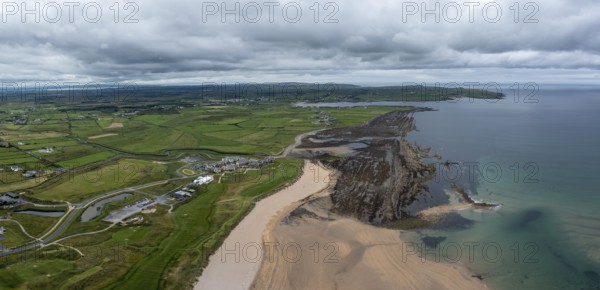 An aerial view of Doughmore Bay and Beach with the Trump International Golf Club hotel and golf course