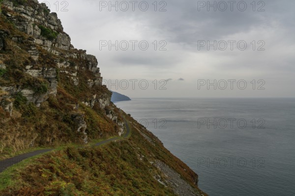 View of the narrow hiking trail on the coastal walk in the Valley of the Rocks in Exmoor in North Devon