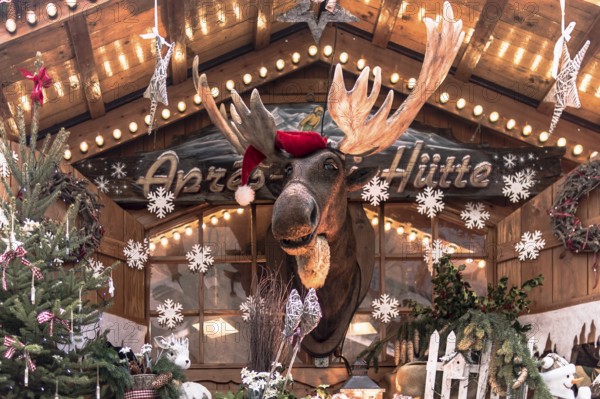 Christmas market hut with elk and Christmas decorations